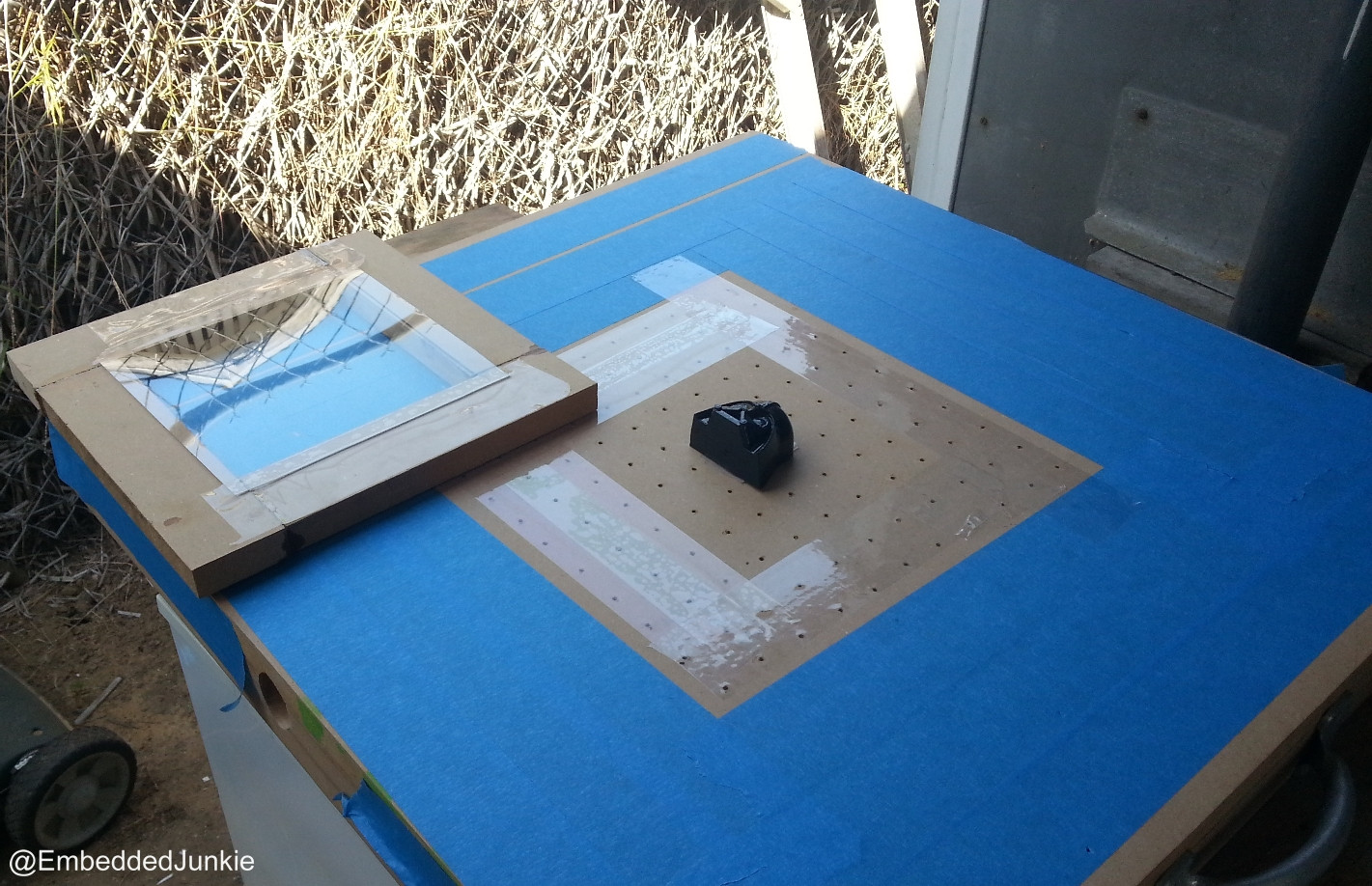 08 - Adhere the Darth Vader 3D print to the vacuum surface I used a loop of packing tape to temporarily adhere the print to the table.